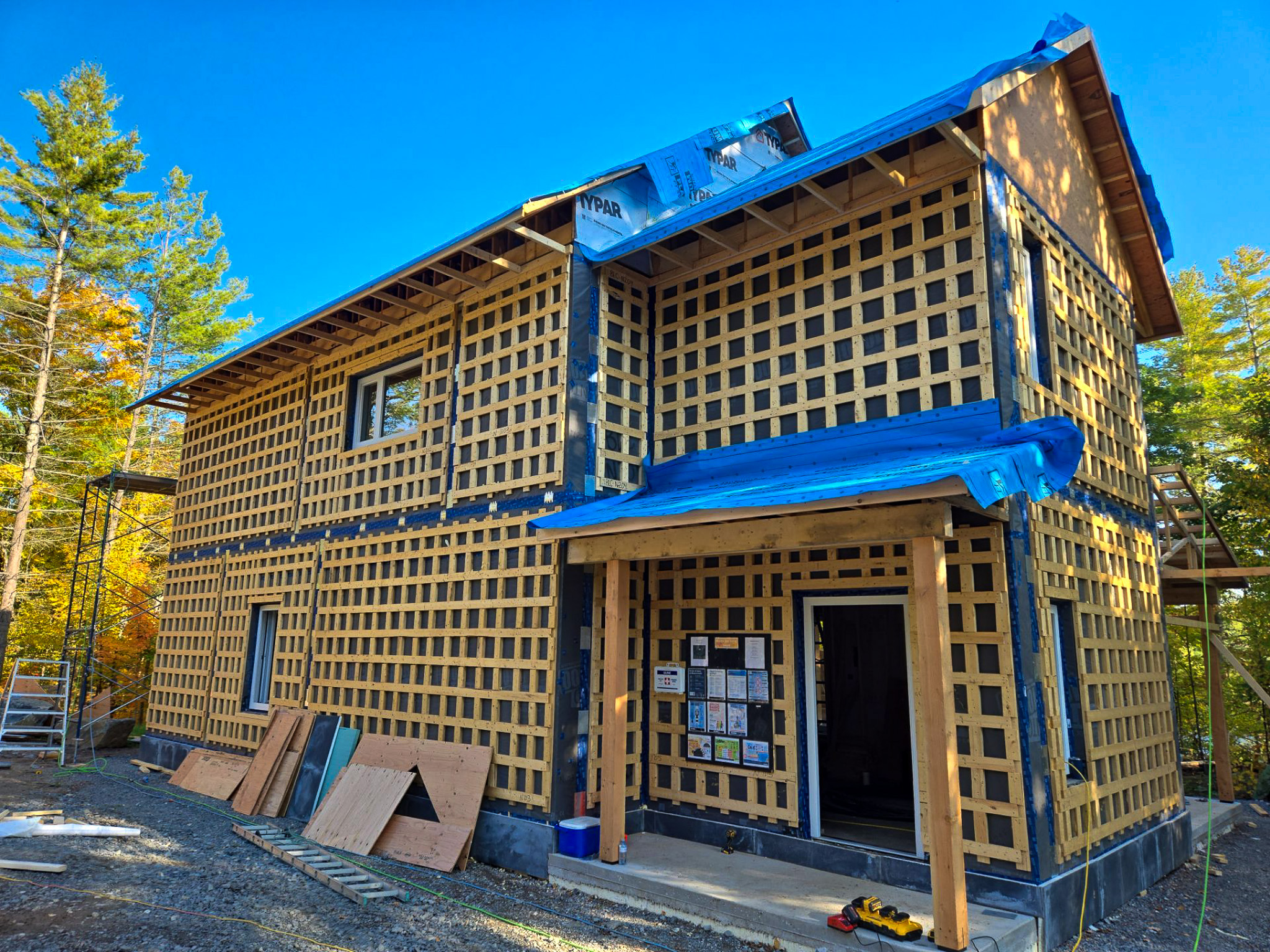 Prefabricated Passive House panel installation showing structural insulated wall system construction