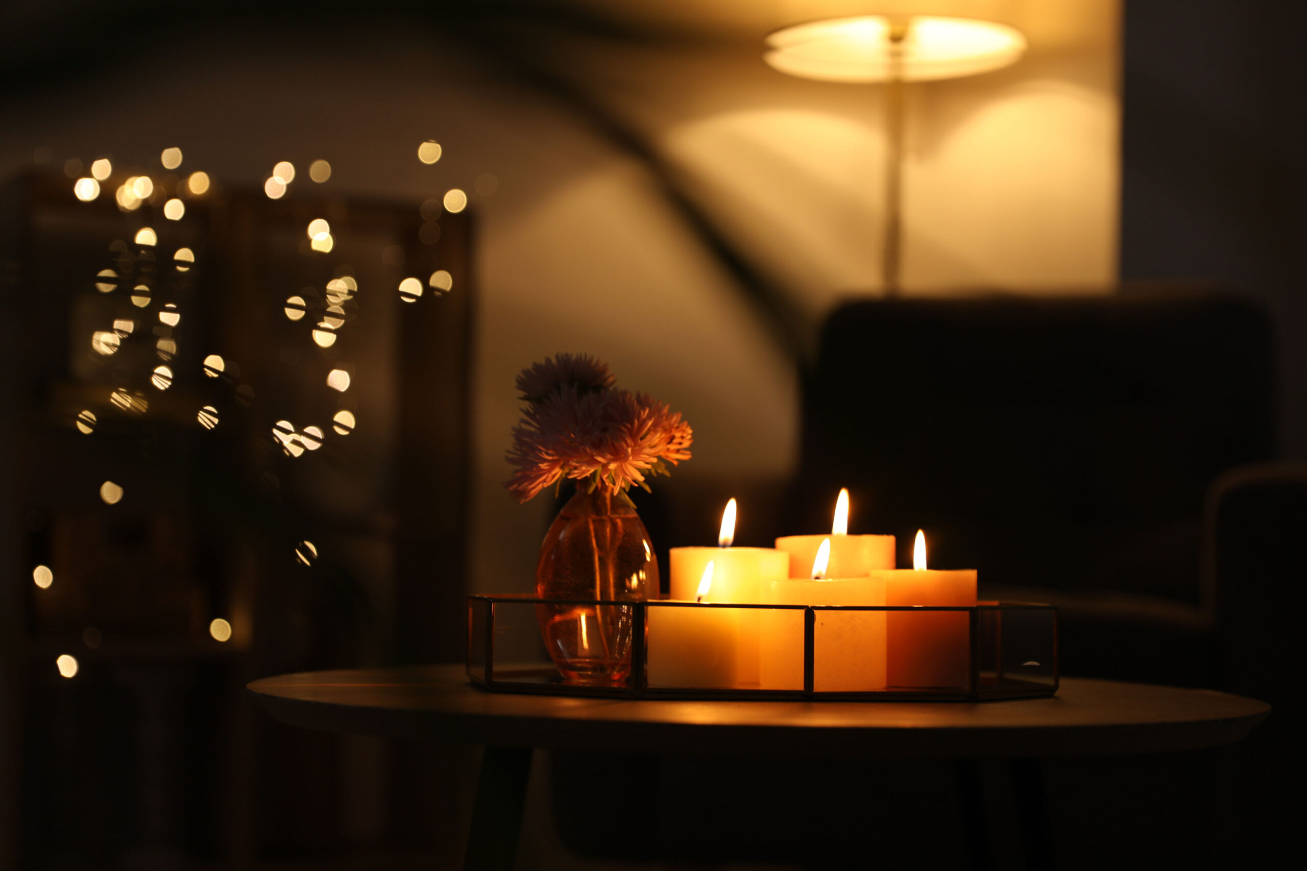 A warm, candlelit interior during a power outage